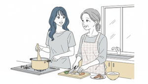 キッチンで母親と一緒にご飯を作る女性の画像