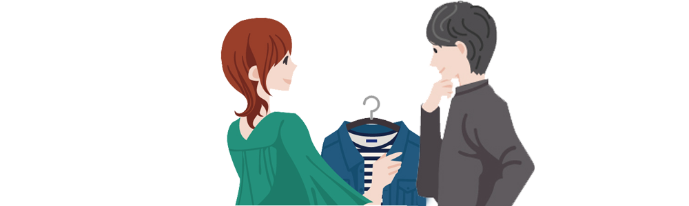 買い物で服を選ぶ男女の画像
